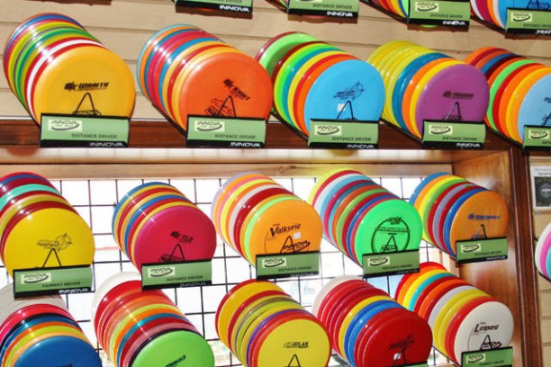 A rack of disk golf disks