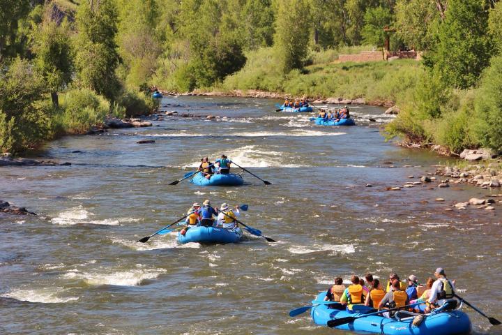 a group of boaters raft down mesa canyon