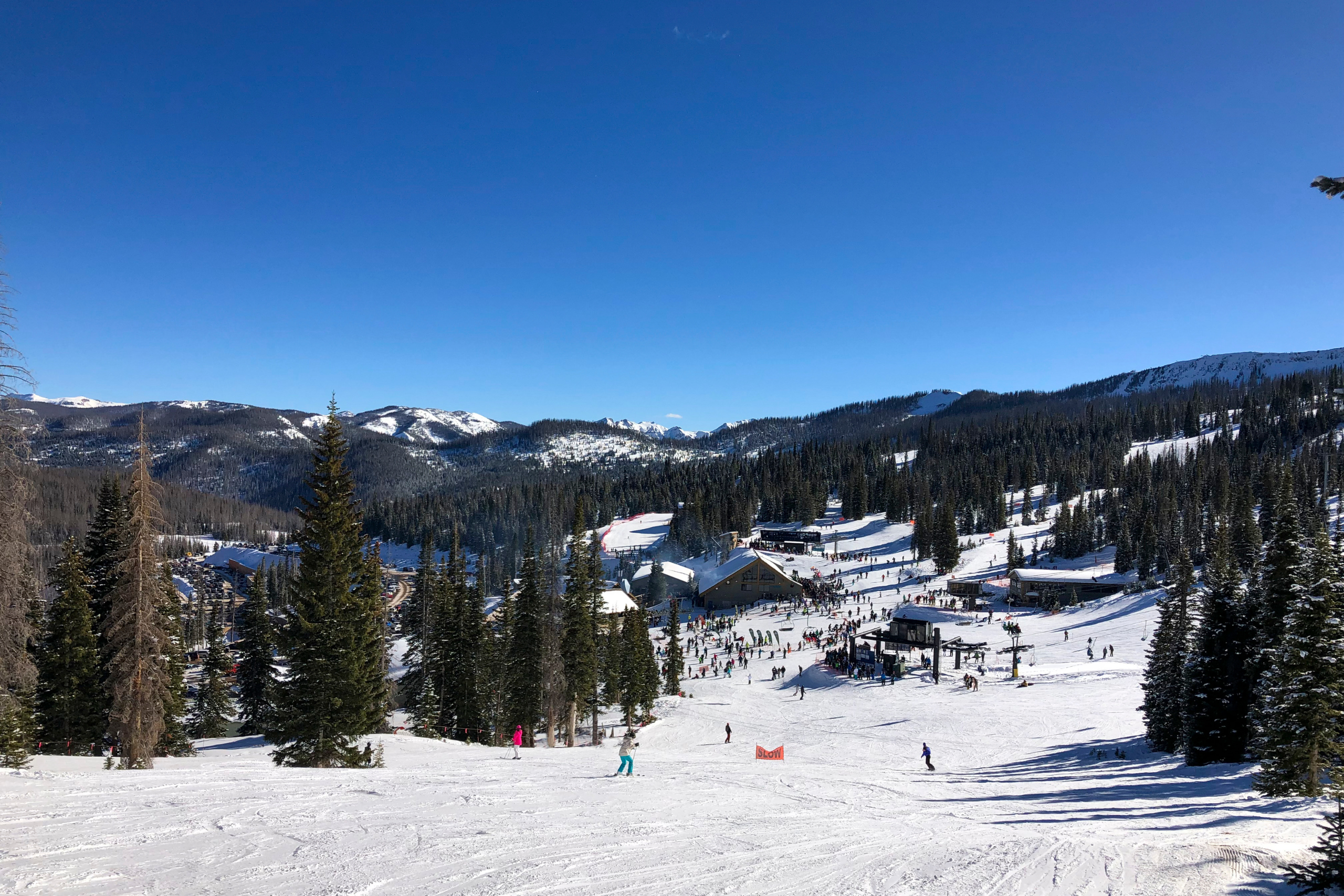 The base and lodge of Wolf Creek Ski area take from the mountain on a sunny day. 